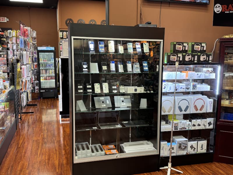 Display case of used phones, tablets, headphones and Bluetooth speakers at Lionz