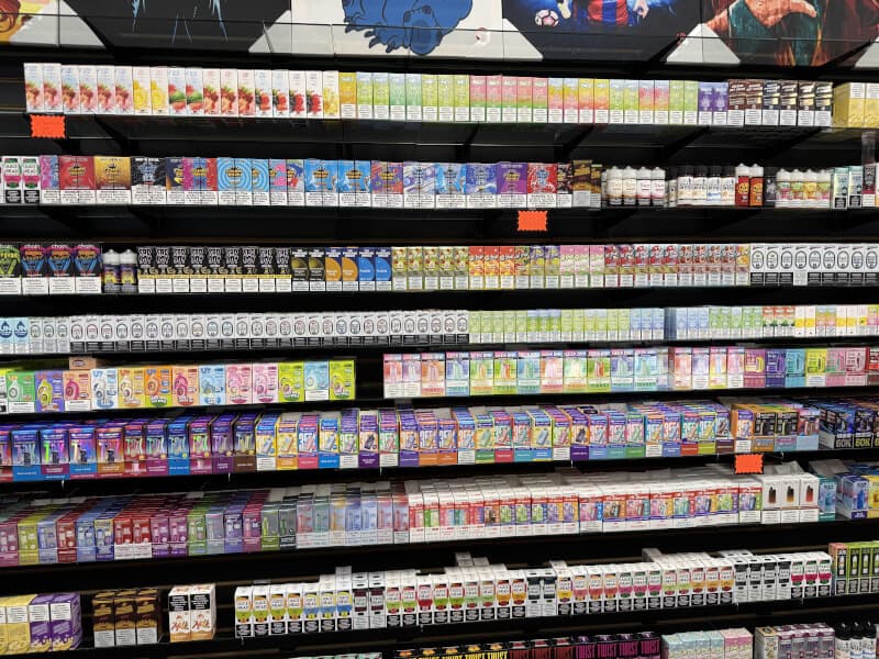 Wall of disposable vapes at Lionz — Geek Bar, Lost Mary, RAZ and Elf Bar displays