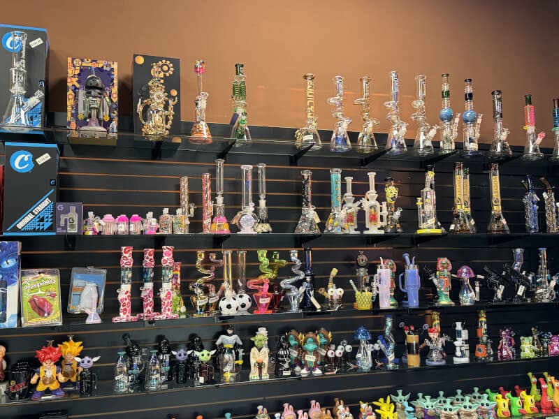 Wall of premium glass water pipes, beakers, bubblers and rigs at Lionz